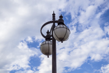 Metal lantern and blue sky