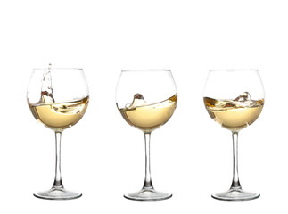 WHITE wine swirling in a goblet wine glass, isolated on a white