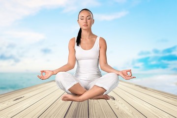 Fototapeta na wymiar Yoga, Meditating, Women.