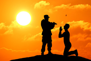 Fototapeta na wymiar Silhouette shot of soldier holding gun with colorful sky and mountain in background