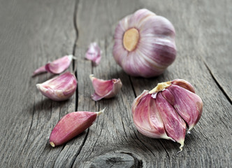 Cloves of garlic on wooden background