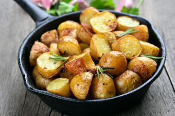 Potatoes fried in pan