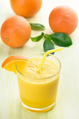 Glass of orange smoothie