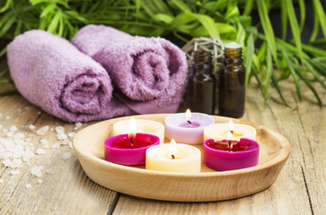 Obraz na płótnie Canvas Spa.Scented Candles, Essential Oil and Towels