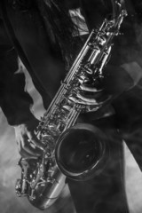 Obraz premium Young lady with her saxophone
