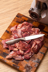 he electric meat grinder and the cut meat