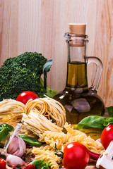 Pasta ingredients on a wood background
