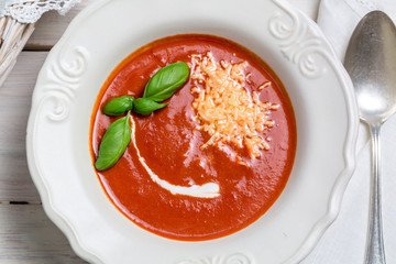 Tomato soup with cheese, basil and cream