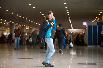 Girl on phone in airport