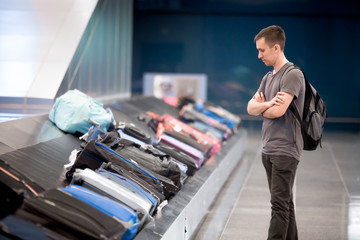 Young man waiting for baggage