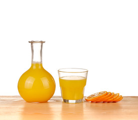 Fresh Orange juice with sliced fruit on the wood background