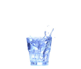Glass of water, ice and slice of fresh lemon on a white background