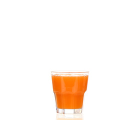 Juice pouring into glass isolated on white