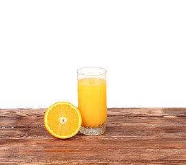 Glass of freshly pressed orange juice with sliced orange 