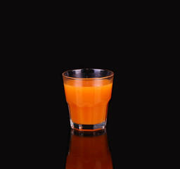 Carrots and juice in a glass