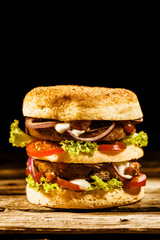 Double-decker green spelt burger with salad