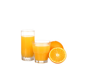 Glass of freshly pressed orange juice with sliced orange 