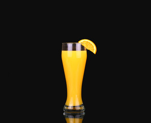 fresh organic orange juice and vodka in a tall glass  