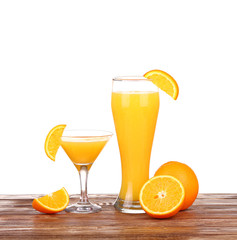 Glass of freshly pressed orange juice with sliced orange