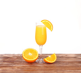 Glass of freshly pressed orange juice with sliced 