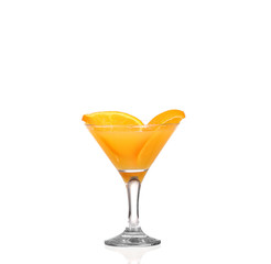 Glass of freshly pressed orange juice with sliced orange 