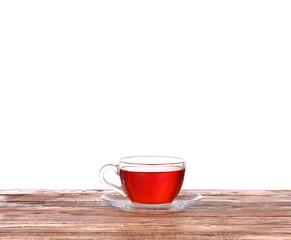 Herbal tea in a glass cup, fresh flowers 