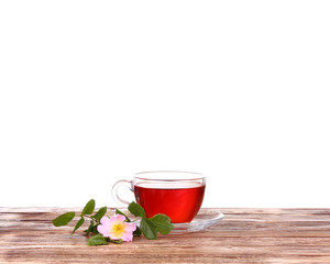 Herbal tea in a glass cup, fresh flowers 
