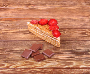 A cup of tea or coffee. Dark Chocolate. Wooden background.