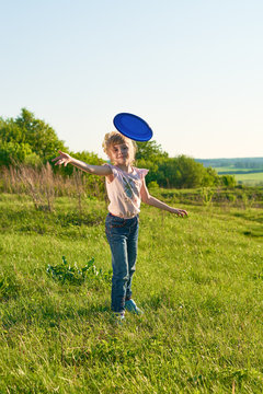 Girl playing frisbee in the park