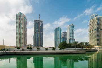Obraz premium Tall skyscrapers in Dubai near water