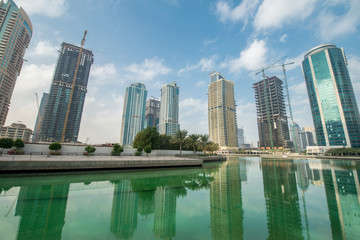 Tall skyscrapers in Dubai near water