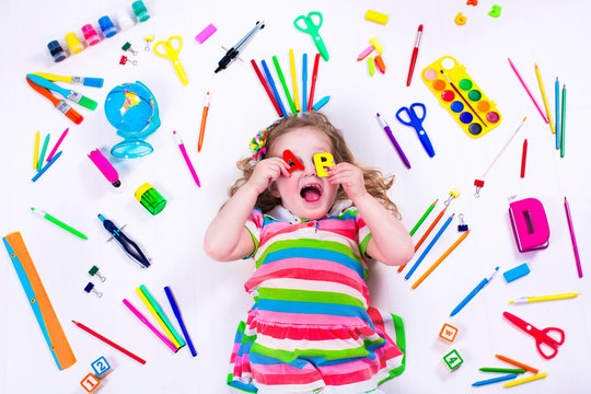 Littel Girl With School Supplies