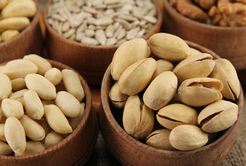 Abstract view of the mixture of nuts in a round wooden form