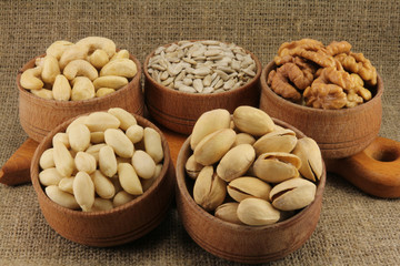 Abstract view of the mixture of nuts in a round wooden form