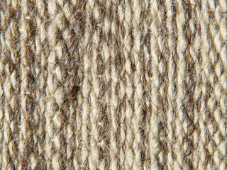 Rough knit camel wool fabric texture pattern.
