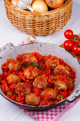 Meatballs with tomato sauce in a pan
