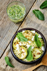 zucchini, millet, mint, pumpkin seeds, goat cheese salad with co