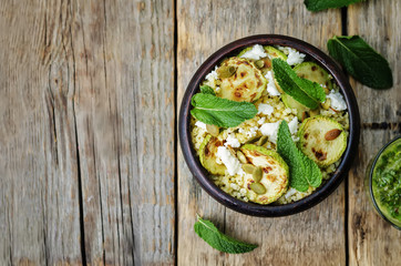 zucchini, millet, mint, pumpkin seeds, goat cheese salad with co
