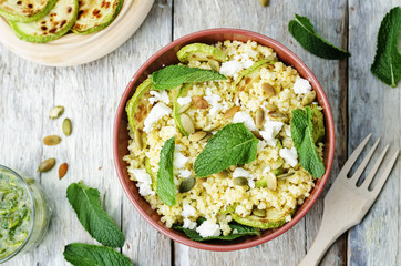 zucchini, millet, mint, pumpkin seeds, goat cheese salad with co