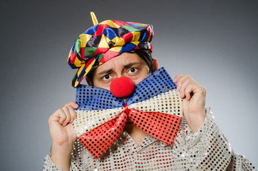 Funny clown against dark background