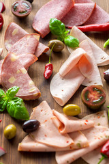 Delicious sliced salami and ham