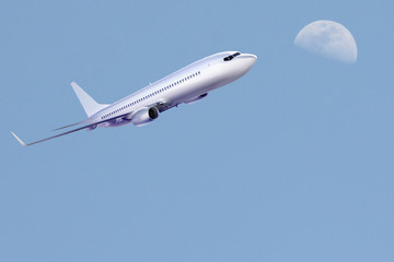 Obraz na płótnie Canvas Airplane Sky and Moon
