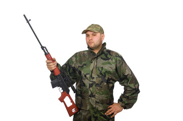 Young man in soldier uniform holding gun isolated on white