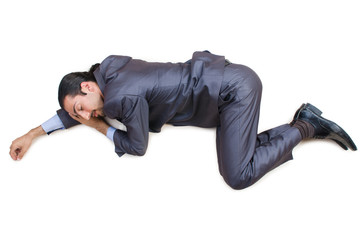 Businessman on the floor isolated on white
