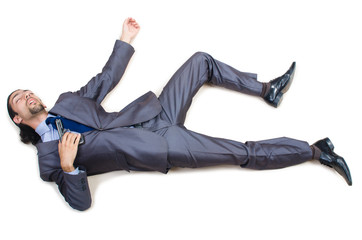 Businessman on the floor isolated on white
