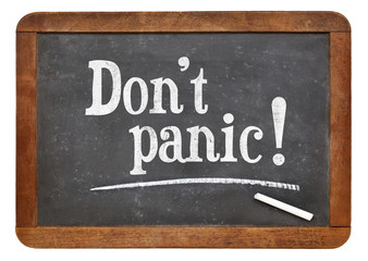 Obraz premium Do not panic - text on blackboard