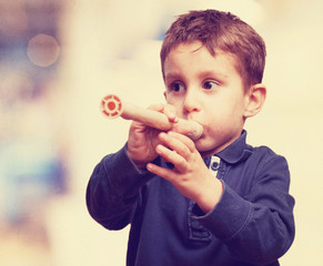 little kid playing flute © asierromero