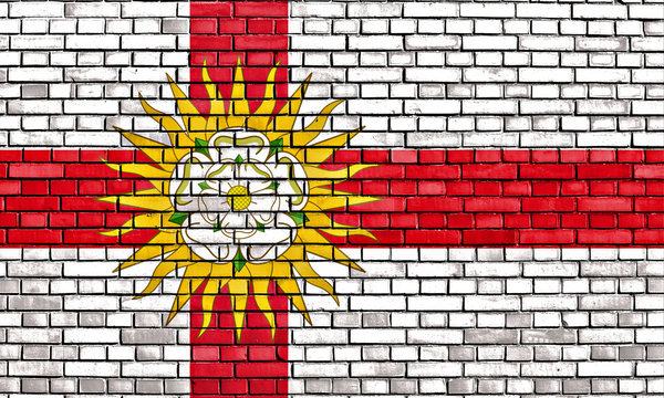 flag of West Riding of Yorkshire painted on brick wall
