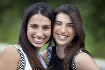 Two young women smiling at the camera