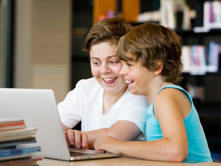 Two boys in library